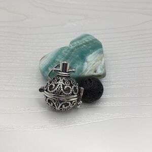 Pattern Aromatherapy Silver tone Locket.  Lava stone included.